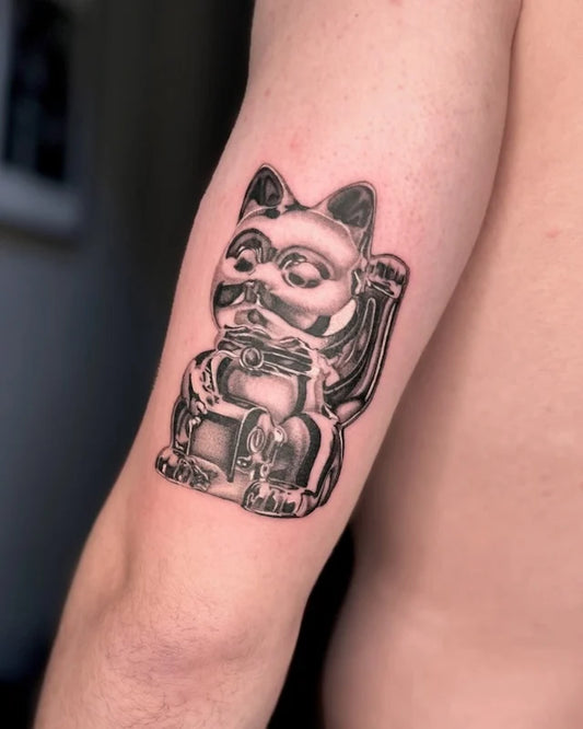 black and grey dotwork 3d lucky cat tattoo on man upper arm