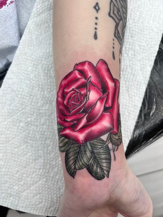Small Realism Rose Flower Tattoo on Women Wrist