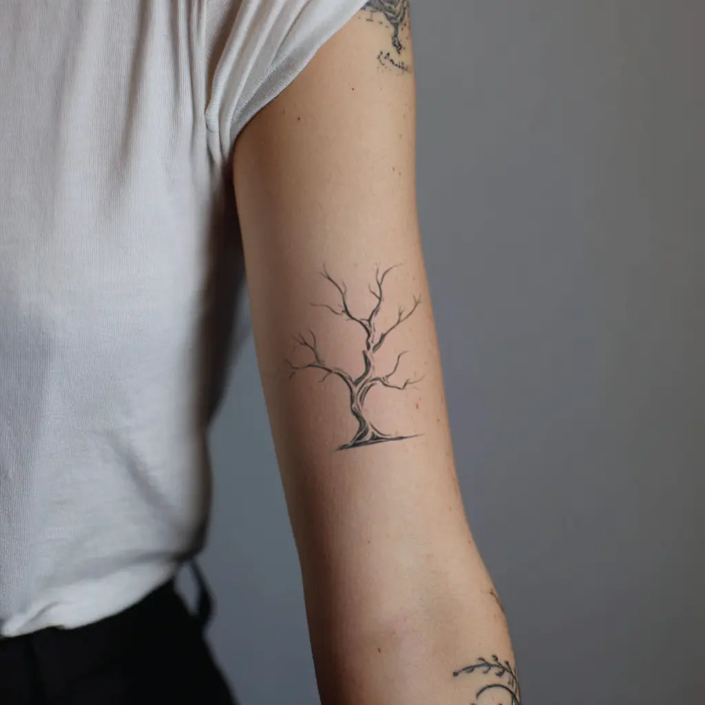 poison tree fine line bicep temporary tattoo idea design