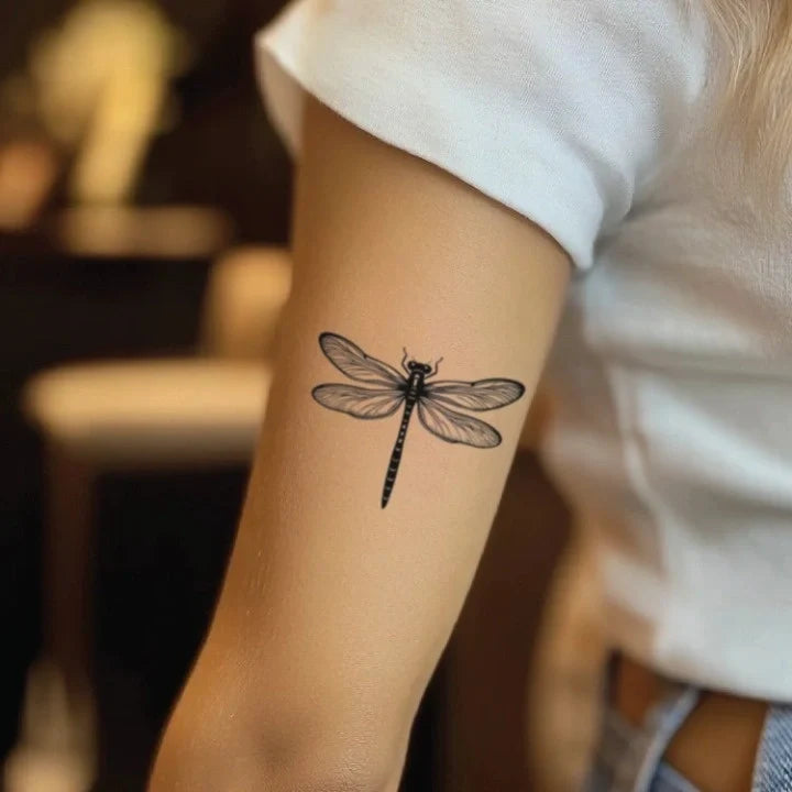 fine line dragonfly bicep temporary tattoo idea design