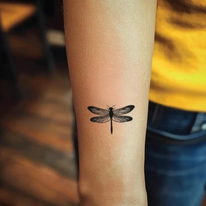 small dragonfly forearm temporary tattoo idea design