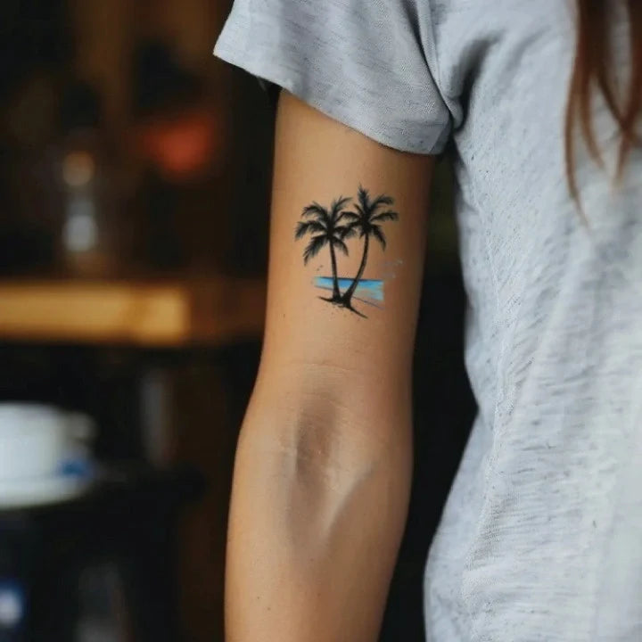 palm tree beach bicep temporary tattoo idea design