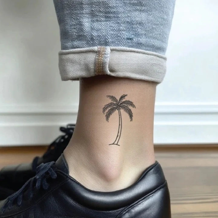 small palm tree outline leg temporary tattoo idea design