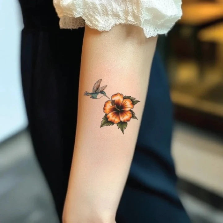 hibiscus and hummingbird forearm temporary tattoo idea design