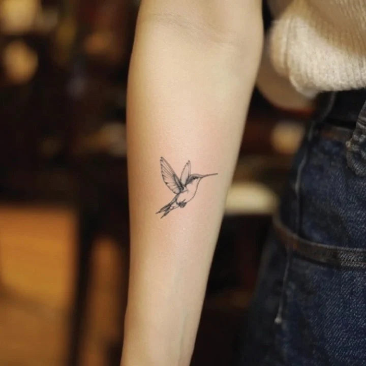 small hummingbird forearm temporary tattoo idea design