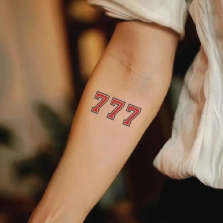red 777 forearm temporary tattoo idea design