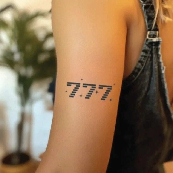 777 angel number bicep temporary tattoo idea design