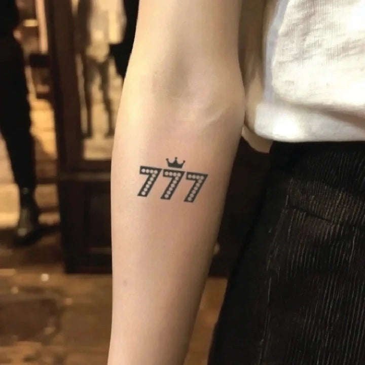 lucky 777 with crown forearm temporary tattoo idea design