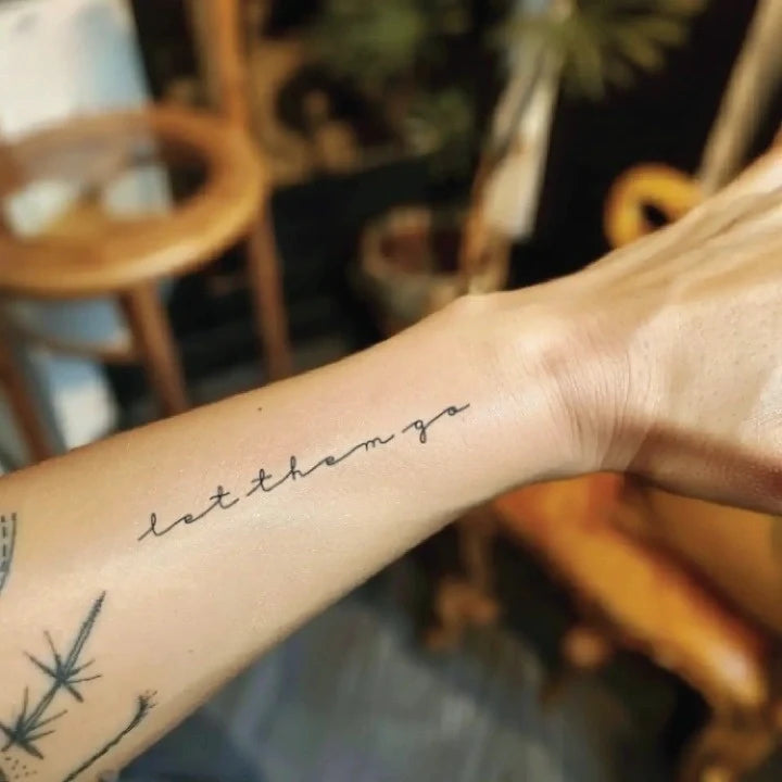 let them go cursive forearm temporary tattoo idea design