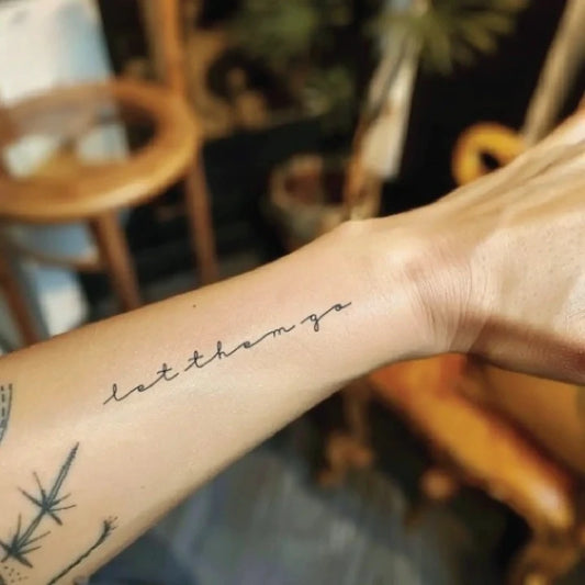 let them go cursive forearm temporary tattoo idea design