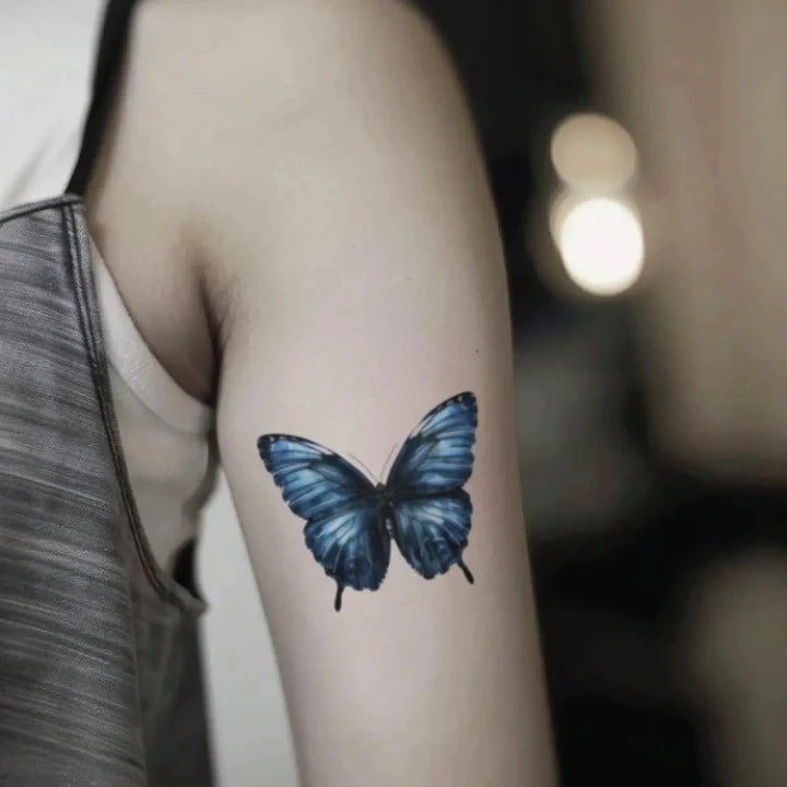 blue butterfly bicep temporary tattoo idea design