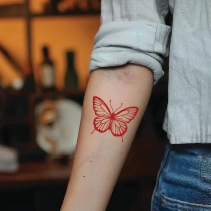 red butterfly forearm temporary tattoo idea design