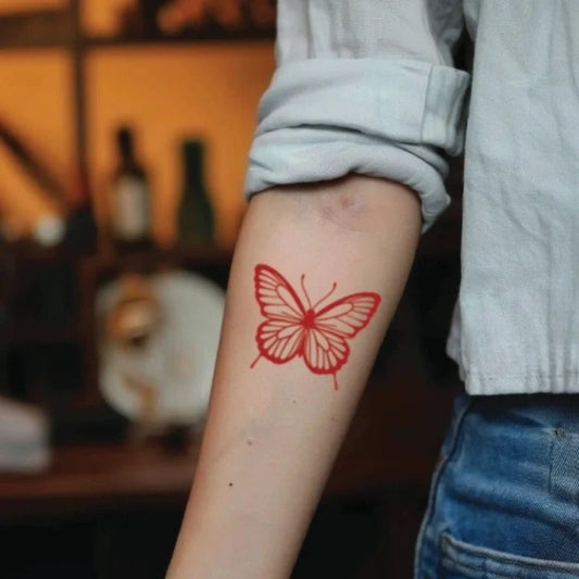 red butterfly forearm temporary tattoo idea design