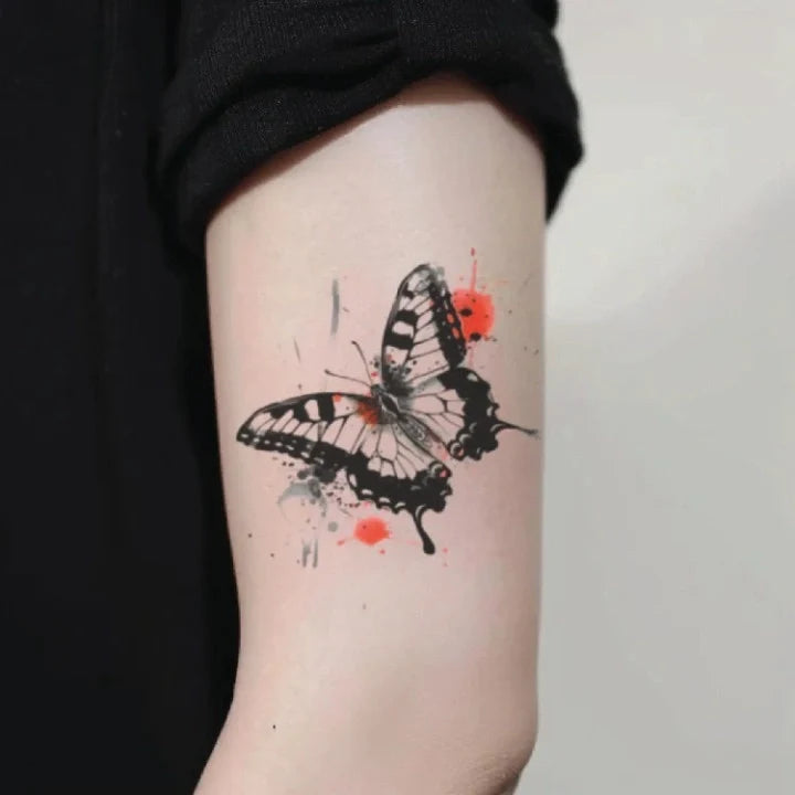 trash polka butterfly bicep temporary tattoo idea design