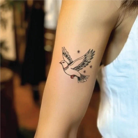 simple traditional dove outline bicep temporary tattoo idea design