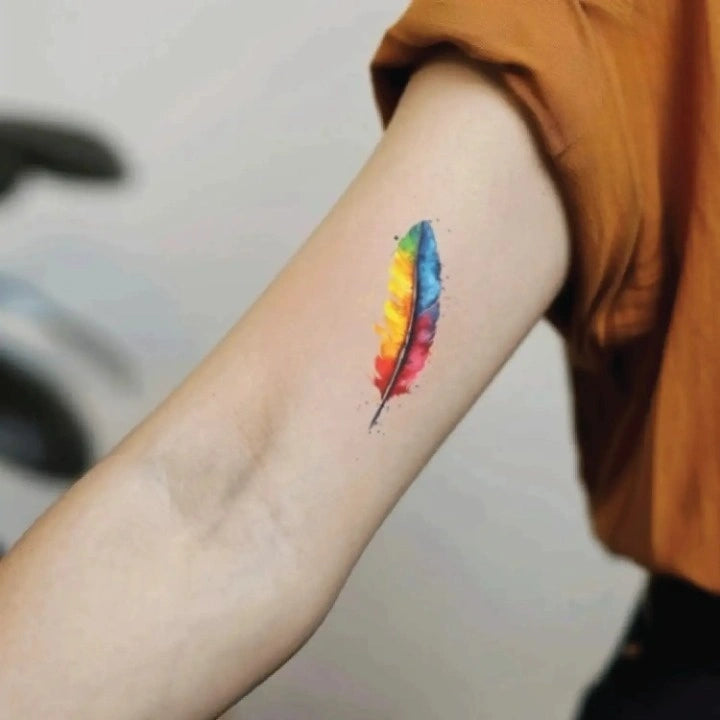 simple colorful watercolor feather bicep temporary tattoo idea design