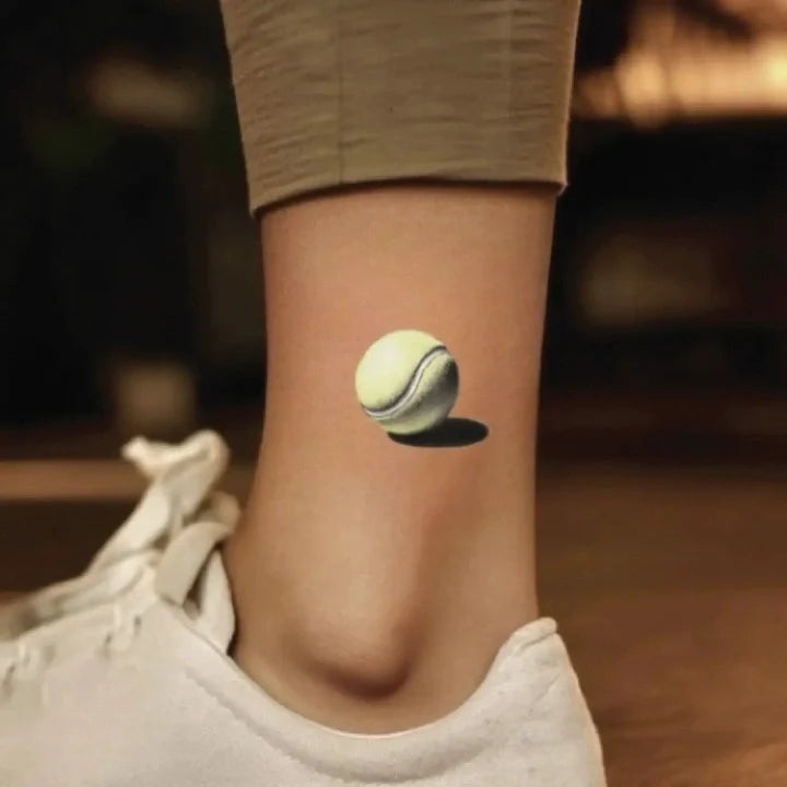 simple realistic tennis ball ankle temporary tattoo idea design