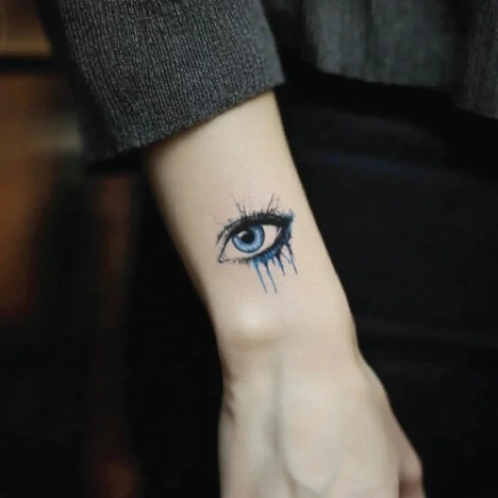 realistic blue evil eye wrist temporary tattoo idea design
