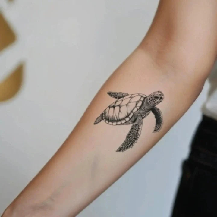 simple realistic sea turtle forearm temporary tattoo idea design