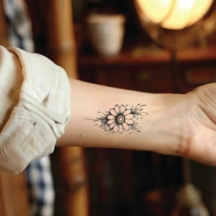 minimal daisy flower outline wrist temporary tattoo idea design