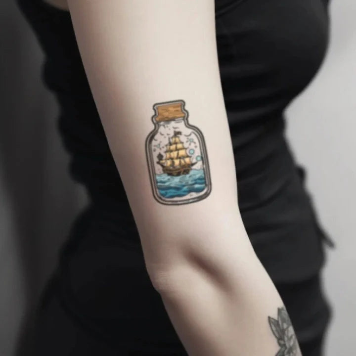 ship in a bottle bicep temporary tattoo idea design