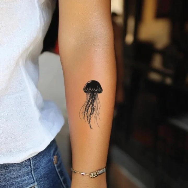 black and white jellyfish forearm temporary tattoo idea design