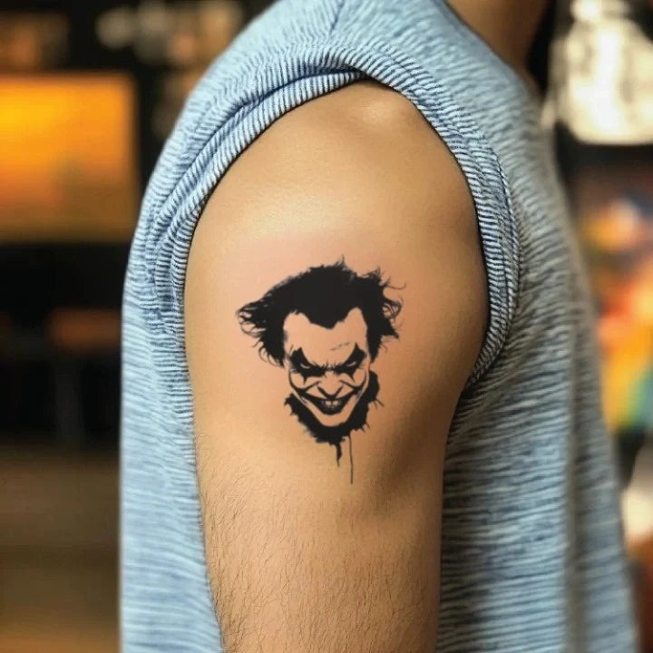 black and white joker bicep temporary tattoo idea design