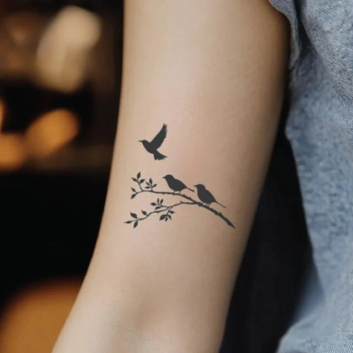 two birds one flying away bicep temporary tattoo idea design