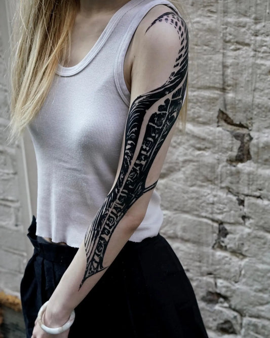 blackwork tattoo on woman full arm sleeve