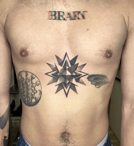 black and grey dotwork 3d geometric star tattoo on man chest