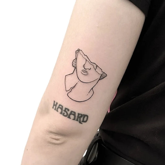 half sculpture statue outline fine line tattoo on upper arm