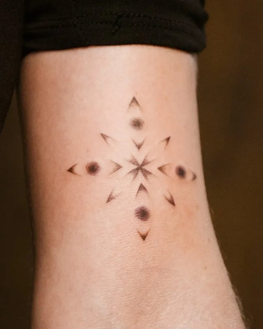geometric tattoo on upper arm