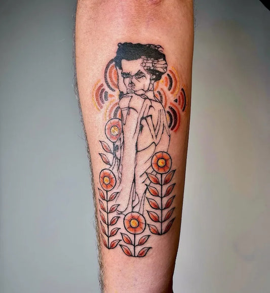 abstract colorful man tattoo with flowers on forearm