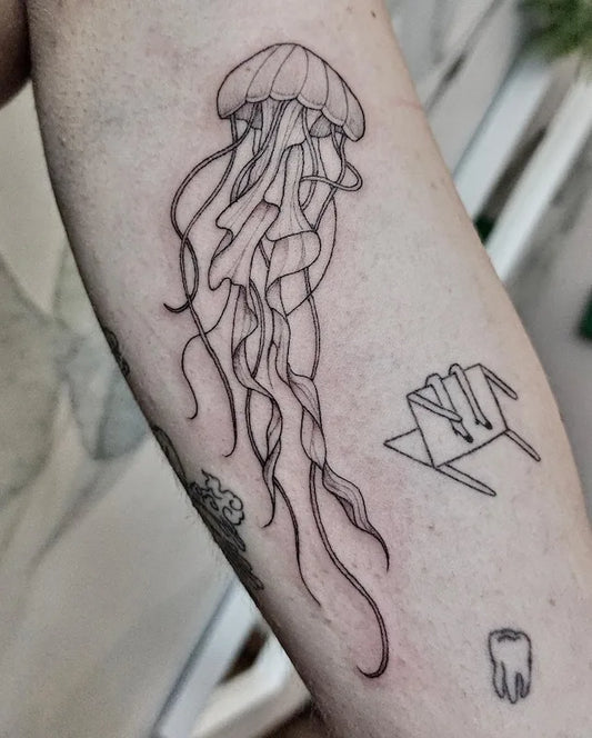 jellyfish outline tattoo on arm