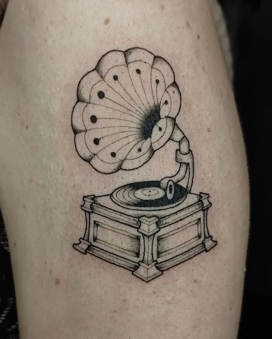 outline tattoo of a vintage gramophone