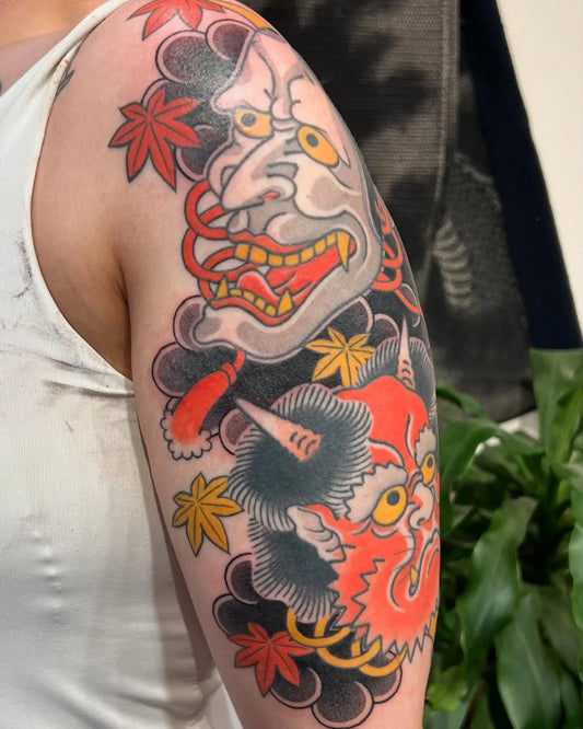 japanese hannya masks half sleeve tattoo on upper arm