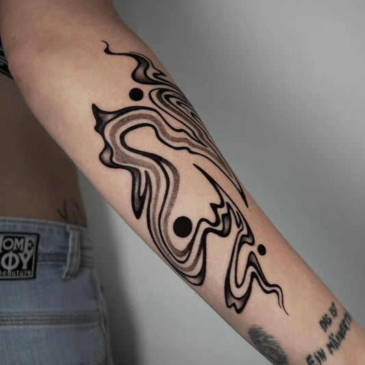 blackwork abstract tattoo on woman forearm