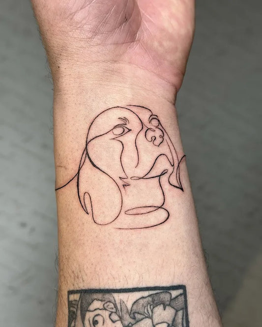 one line dog fine line tattoo on wrist