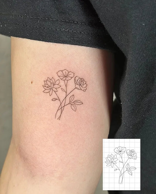 fine line flowers minimalist tattoo on bicep