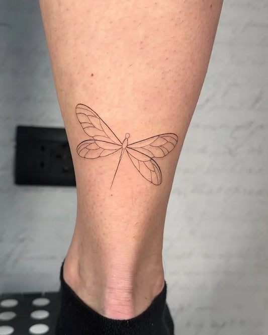 fine line dragonfly tattoo on ankle