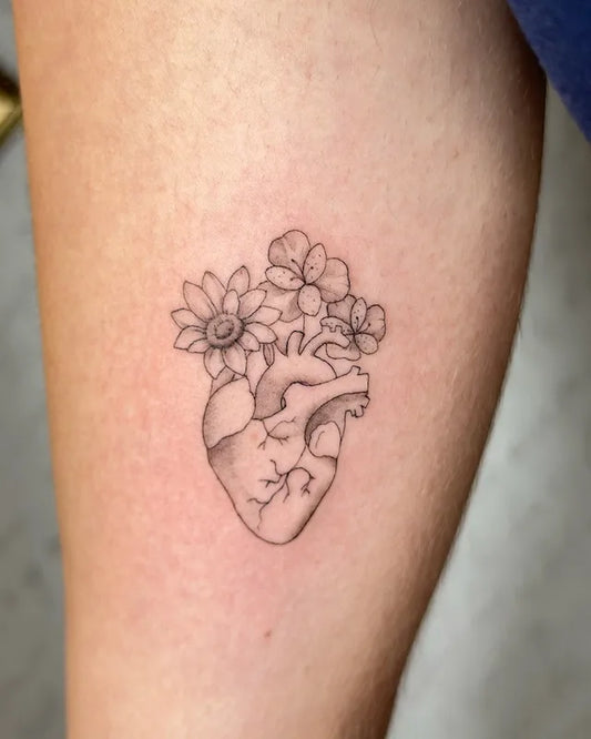 floral anatomical heart fine line minimalist tattoo