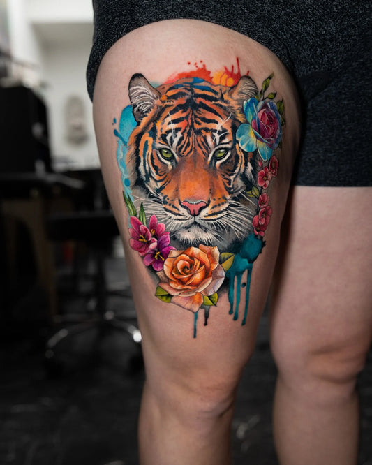 color realism tiger tattoo on woman thigh