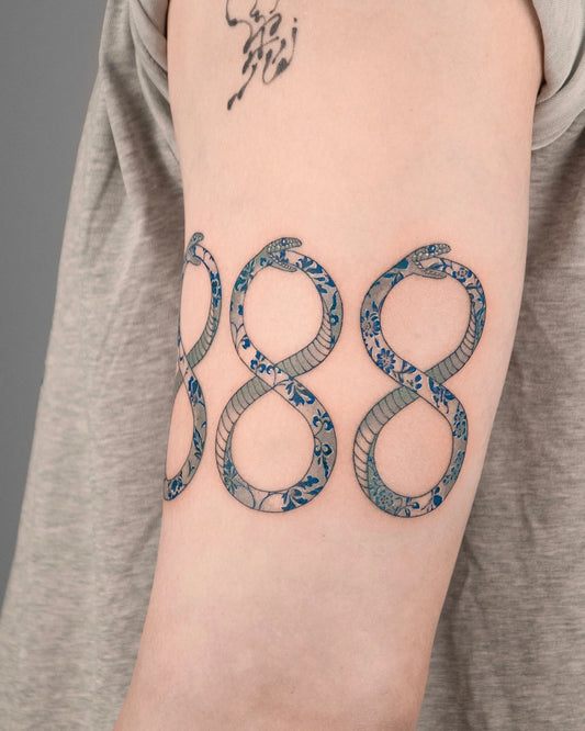 chinese style porcelain infinity snakes number eight tattoo on upper arm