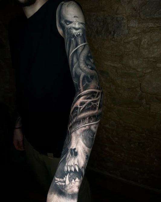alien skull black and grey darkwork realism tattoo full arm sleeve