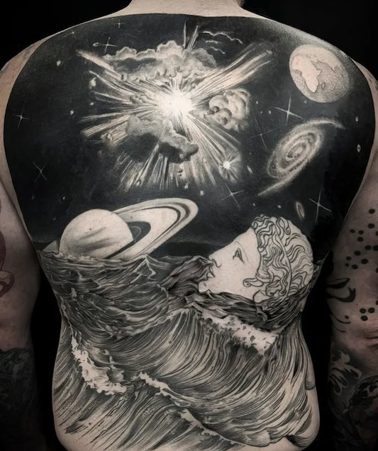 back full piece blackwork abstract tattoo of a celestial scene with planets and a human