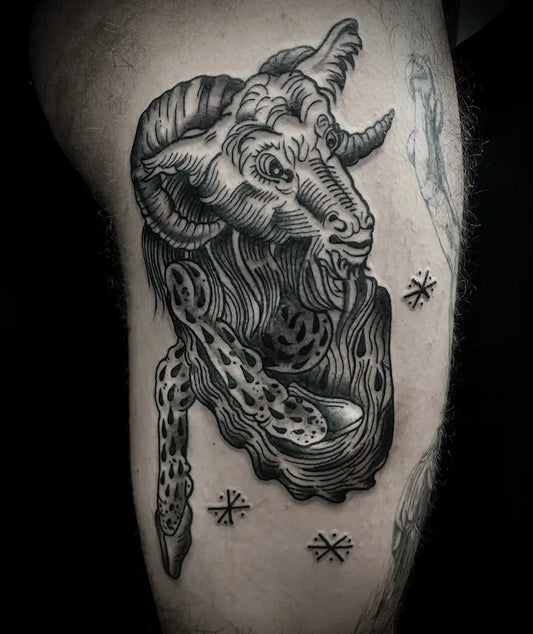 black and grey ram goat tattoo
