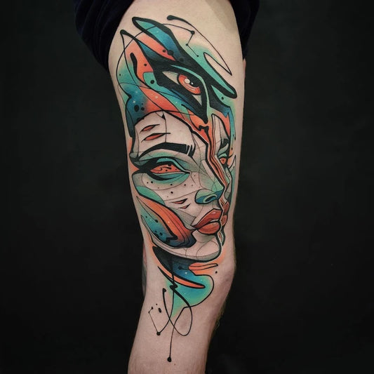 colorful new school neo-traditional abstract geometric woman tattoo on woman thigh