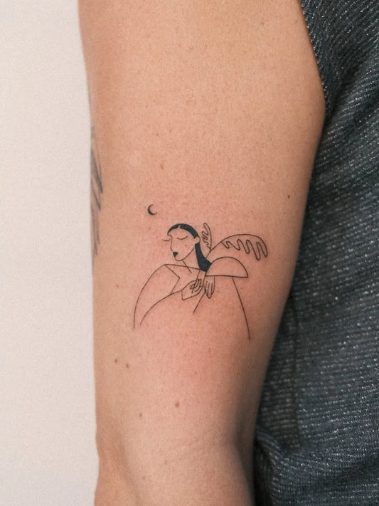 abstract woman fine line tattoo on upper arm