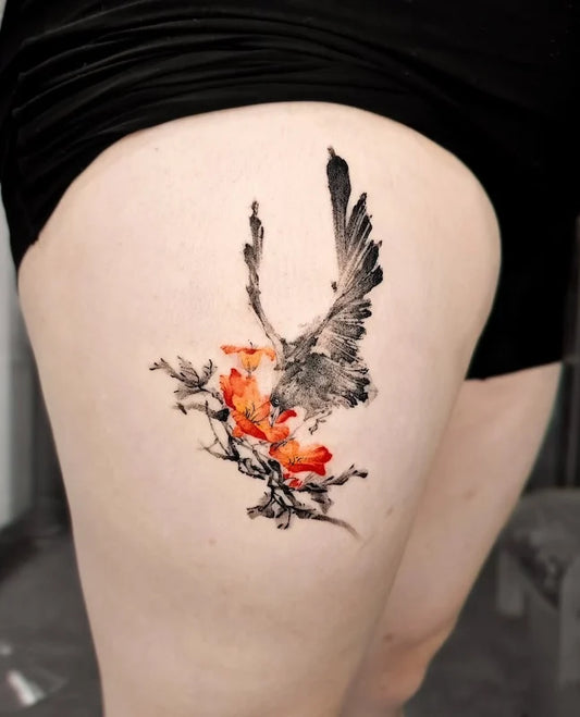 oriental painting bird and flower tattoo on woman thigh