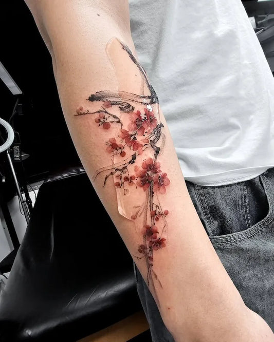 oriental cherry blossom tattoo on forearm